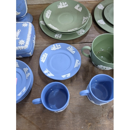 31 - Wedgwood Jasper stoneware to include cup, saucers, and plates, a vase and other items
Location: LAB
... 