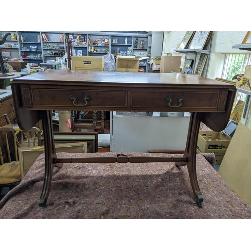 33 - A late 20th century yew sofa table with drawers, on splayed legs
Location: BWR
If there is no condit... 