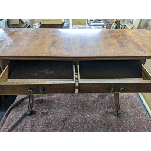 33 - A late 20th century yew sofa table with drawers, on splayed legs
Location: BWR
If there is no condit... 