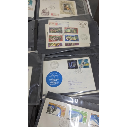 374 - A large quantity of first day covers from around the world along with two albums of Post Office post... 