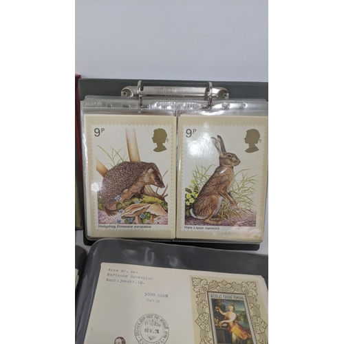 374 - A large quantity of first day covers from around the world along with two albums of Post Office post... 