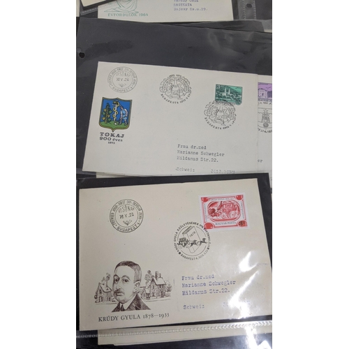 374 - A large quantity of first day covers from around the world along with two albums of Post Office post... 