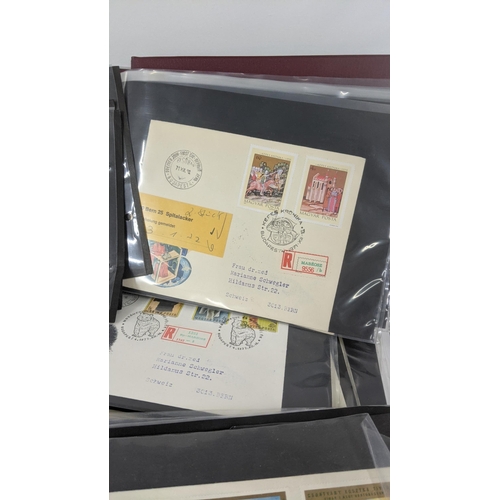 374 - A large quantity of first day covers from around the world along with two albums of Post Office post... 