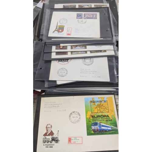 374 - A large quantity of first day covers from around the world along with two albums of Post Office post... 