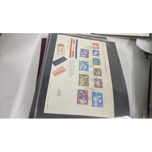 374 - A large quantity of first day covers from around the world along with two albums of Post Office post... 