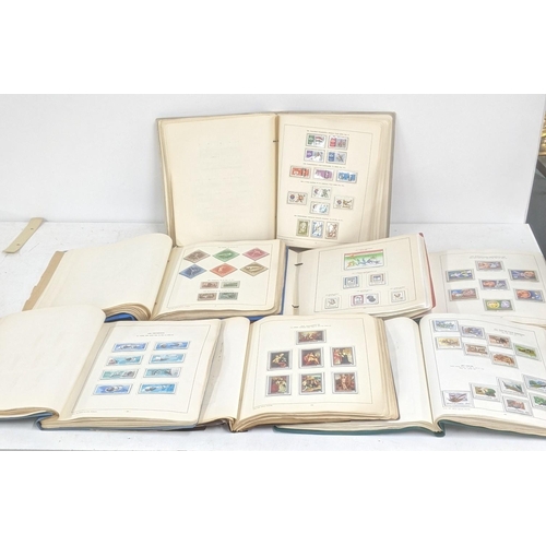 375 - Seven stamp albums filled with sorting stamps to include Olympic stamps, space related examples, mot... 