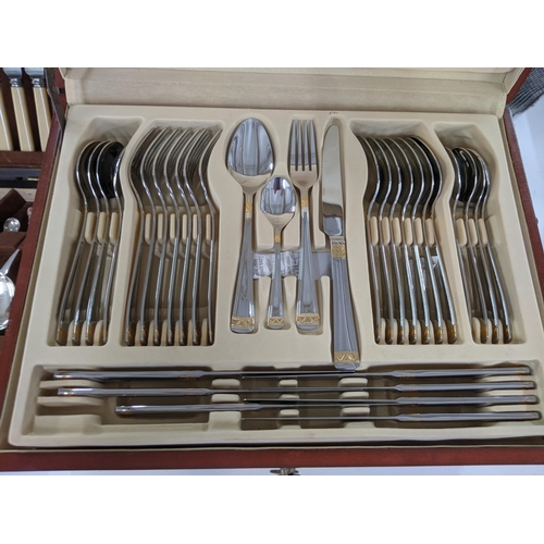 38 - A cased canteen of SBS International stainless steel cutlery, all with bi-coloured design, 86 pieces... 