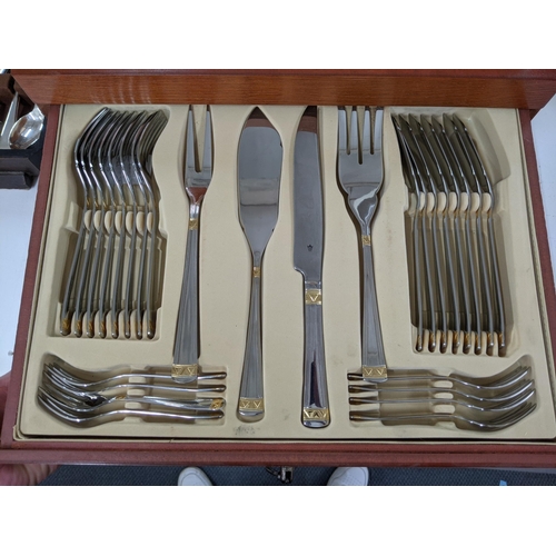 38 - A cased canteen of SBS International stainless steel cutlery, all with bi-coloured design, 86 pieces... 