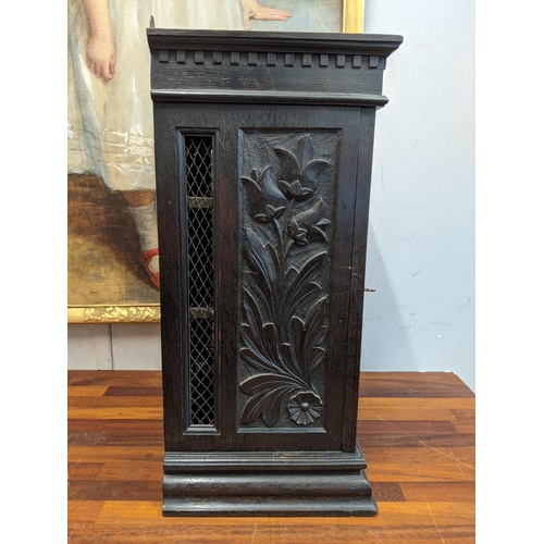 39 - An early 20th century carved wooden cabinet with a wire mesh door and sides Location: G
If there is ... 