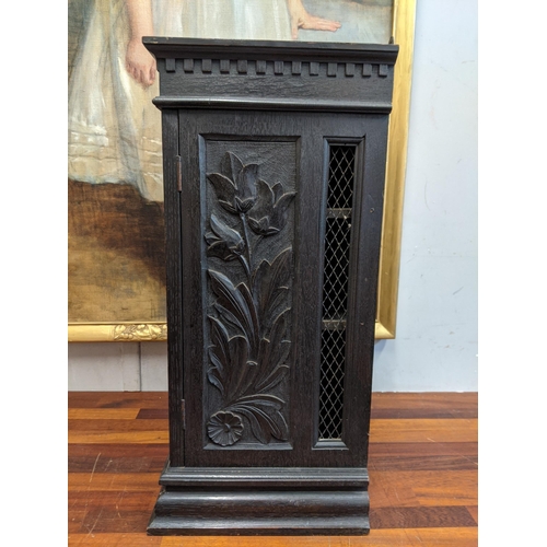 39 - An early 20th century carved wooden cabinet with a wire mesh door and sides Location: G
If there is ... 