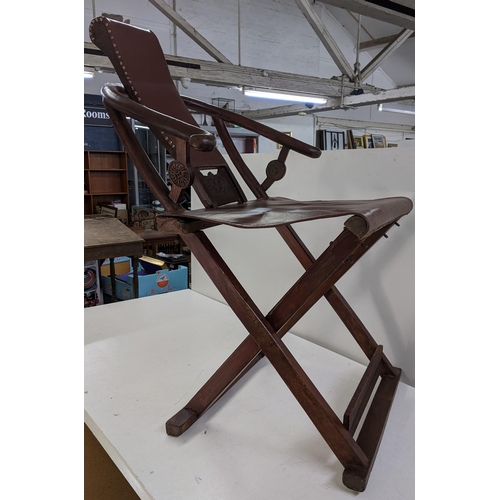 391 - A Chinese folding armchair with horseshoe back and footrest Location:A3B
If there is no condition re... 