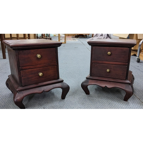 395 - A pair of 20th century Chinese bedside cabinets with two drawers and turned ornate feet Location:RAF... 