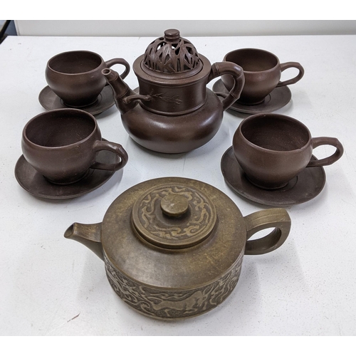 397 - A Yixing brown clay tea set and teapot with ornate decoration Location:R2.1
If there is no condition... 