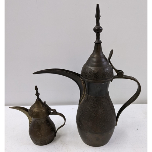 399 - Mixed Qatari items to include two dallah brass coffee pots, and a Shisha pipe Location:10.1
If there... 