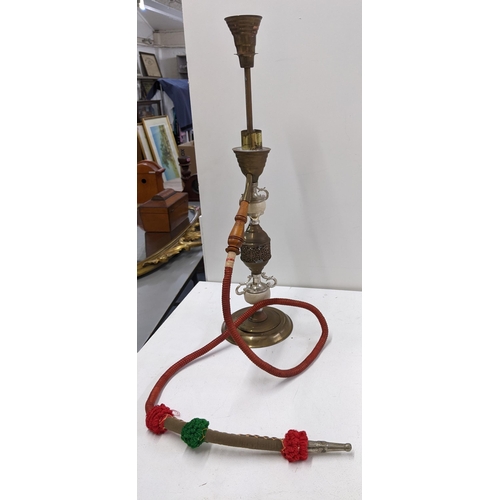 399 - Mixed Qatari items to include two dallah brass coffee pots, and a Shisha pipe Location:10.1
If there... 