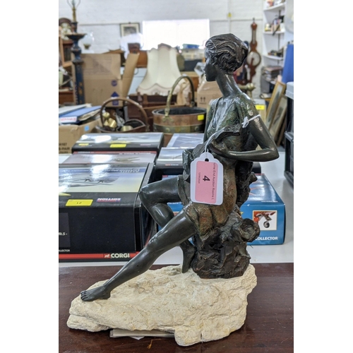 4 - A bronze composite figure of a lady playing a banjo sat on a tree stump on a naturalistic base, sign... 