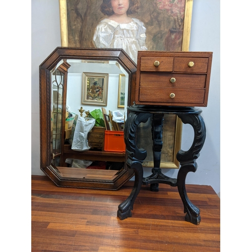 40 - An early 20th century black painted plant stand and a mahogany four-drawer chest containing cutlery ... 