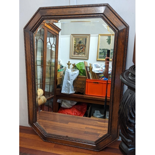 40 - An early 20th century black painted plant stand and a mahogany four-drawer chest containing cutlery ... 