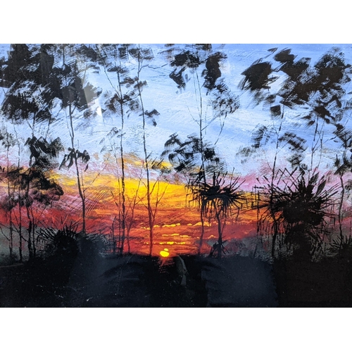 409 - A Rolf Harris limited edition print 142/295 titled New Dawn depicting a sunrise/sunset through exoti... 