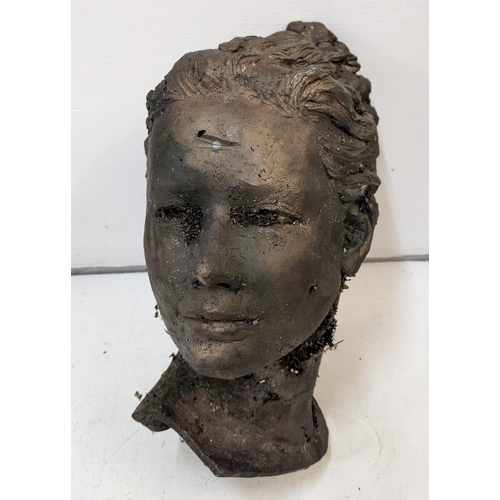 41 - A bronze sculpture of a lady's head measuring approx. 31cm h x 31cm w Location: 1-3
If there is no c... 