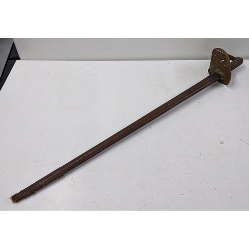 415 - A Cavalry sword with leather sheath and wrought iron handle Location:A1M
If there is no condition re... 