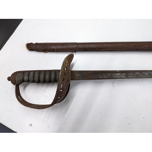 415 - A Cavalry sword with leather sheath and wrought iron handle Location:A1M
If there is no condition re... 