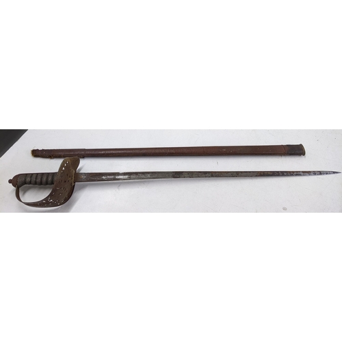 415 - A Cavalry sword with leather sheath and wrought iron handle Location:A1M
If there is no condition re... 