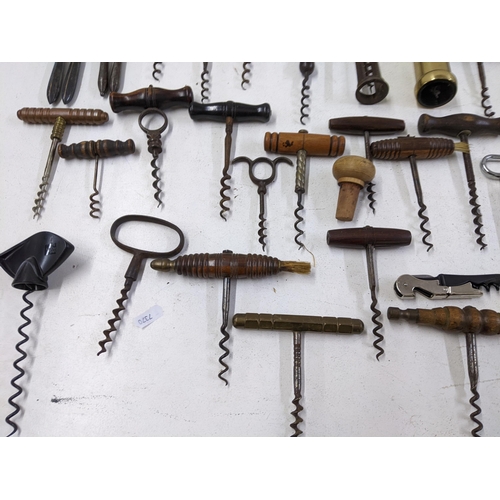 416 - A collection of vintage corkscrews and bottle openers to include a Cognac Courvoisier brass example,... 