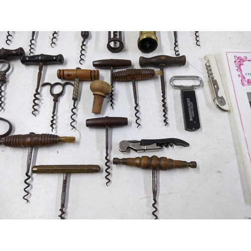 416 - A collection of vintage corkscrews and bottle openers to include a Cognac Courvoisier brass example,... 