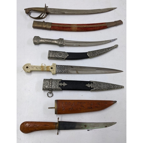 418 - A collection of Indian daggers and a Cavalry sword Location:LWB
If there is no condition report show... 