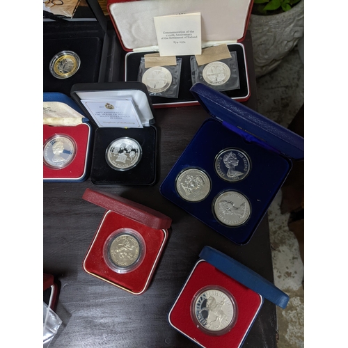 480 - A collection of commemorative silver proof coins and others to include a 2016 UK silver proof commem... 