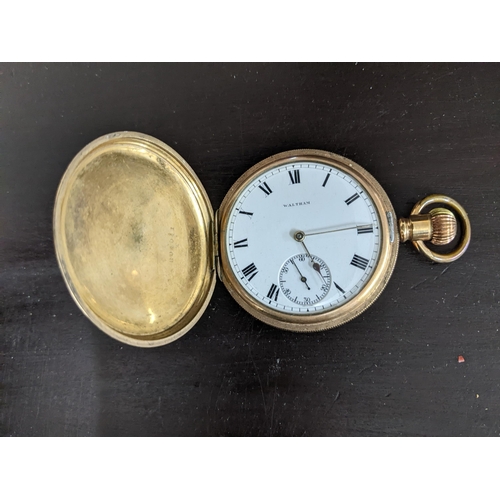 487 - A Waltham Traveller gold plated cased full Hunter pocket watch, white enamel Roman dial with offset ... 