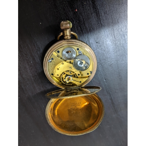 487 - A Waltham Traveller gold plated cased full Hunter pocket watch, white enamel Roman dial with offset ... 