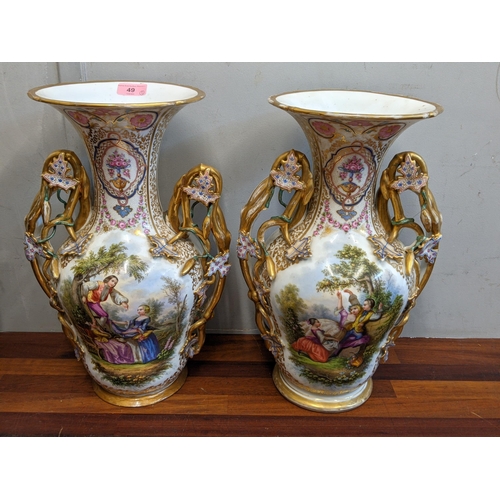 49 - A pair of late 19th century French porcelain painted and gilt vases decorated with panels of figures... 