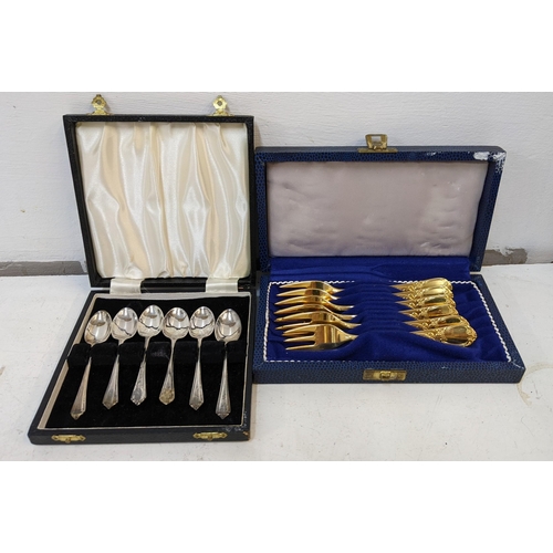 59 - A coffee spoon set, hallmarked Birmingham 1969 by Bishtons Ltd, and a set of gold coloured cake fork... 