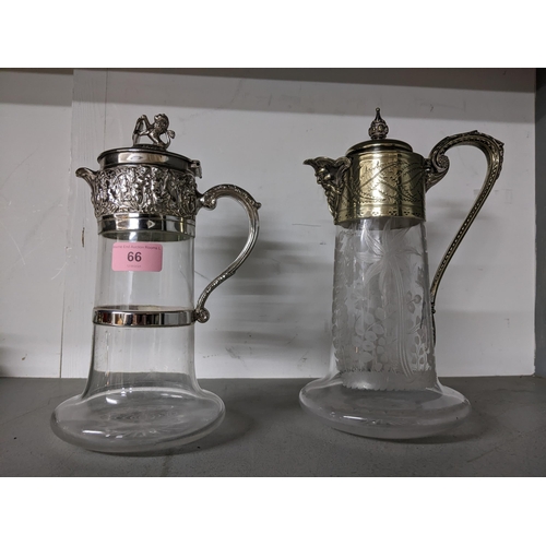 66 - Two claret jugs with cast silver collars, lids and handles, the Victorian one with wheel engraved wi... 