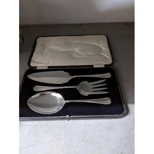 69 - A selection of silver plated items to include a punch bowl and cups with ladle, circular Sheffield p... 