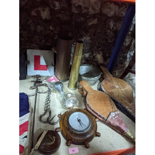 79 - A mixed lot to include a 1st World War and 2nd World War brass shell cases, machine stitched British... 