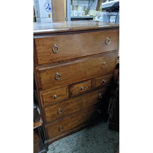 95 - A Stagg mahogany chest of drawers, two long above three short and two further long drawers, on brack... 