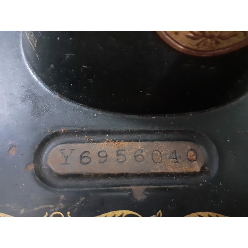 337 - A 1929 99k Singer electric sewing machine A/F, serial number Y695604 having a domed case and oak bas... 