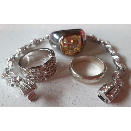 105 - An Attwood & Sawyer silver tone and white crystal bracelet together with a silver ring with faceted ... 