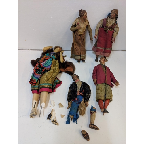 428 - Four 19th Century Neapolitan crib figures A/F and a 1920's wax figure A/F
Location: 7.4

If there is... 