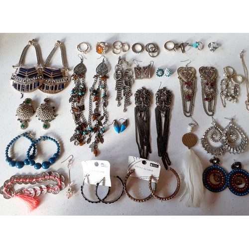 234 - A quantity of costume jewellery to include over-sized earrings, silver and turquoise earrings, costu... 