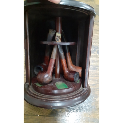 497 - A quantity of vintage pipes, a revolving pip stand and another stand and an oak ashtray
Location: RA... 