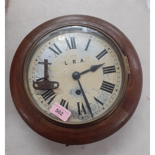 502 - An oak cased Enfield dial clock, circa 1900 with initials L.R.A to the 20cm diameter dial, with key
... 