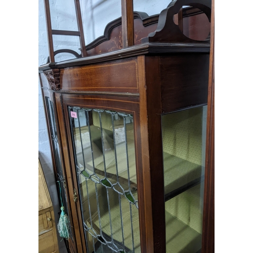 514 - A late Victorian inlaid mahogany bow fronted display cabinet, 3/4 galleried top with inlaid floral d... 