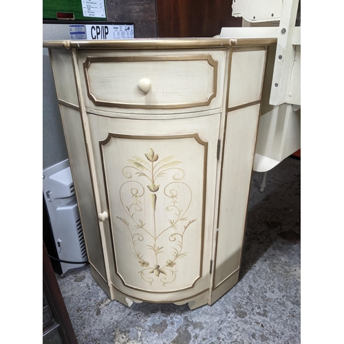 518 - A mid-century cream painted kidney shaped dressing table with triptych swing mirror above a central ... 