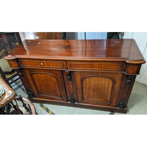 535 - A Victorian mahogany sideboard having two drawers above cupboard doors, 90.5cm h x 149cm w
Location:... 