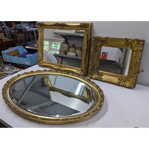 538 - Three gilt framed mirrors to include an oval shaped example 84cm x 58cm, a rectangular example 63.5c... 