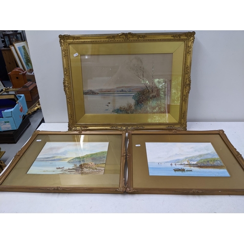 539 - Three gilt framed pictures to include two lake scenes, both signed S Wilson, and another lake scene ... 